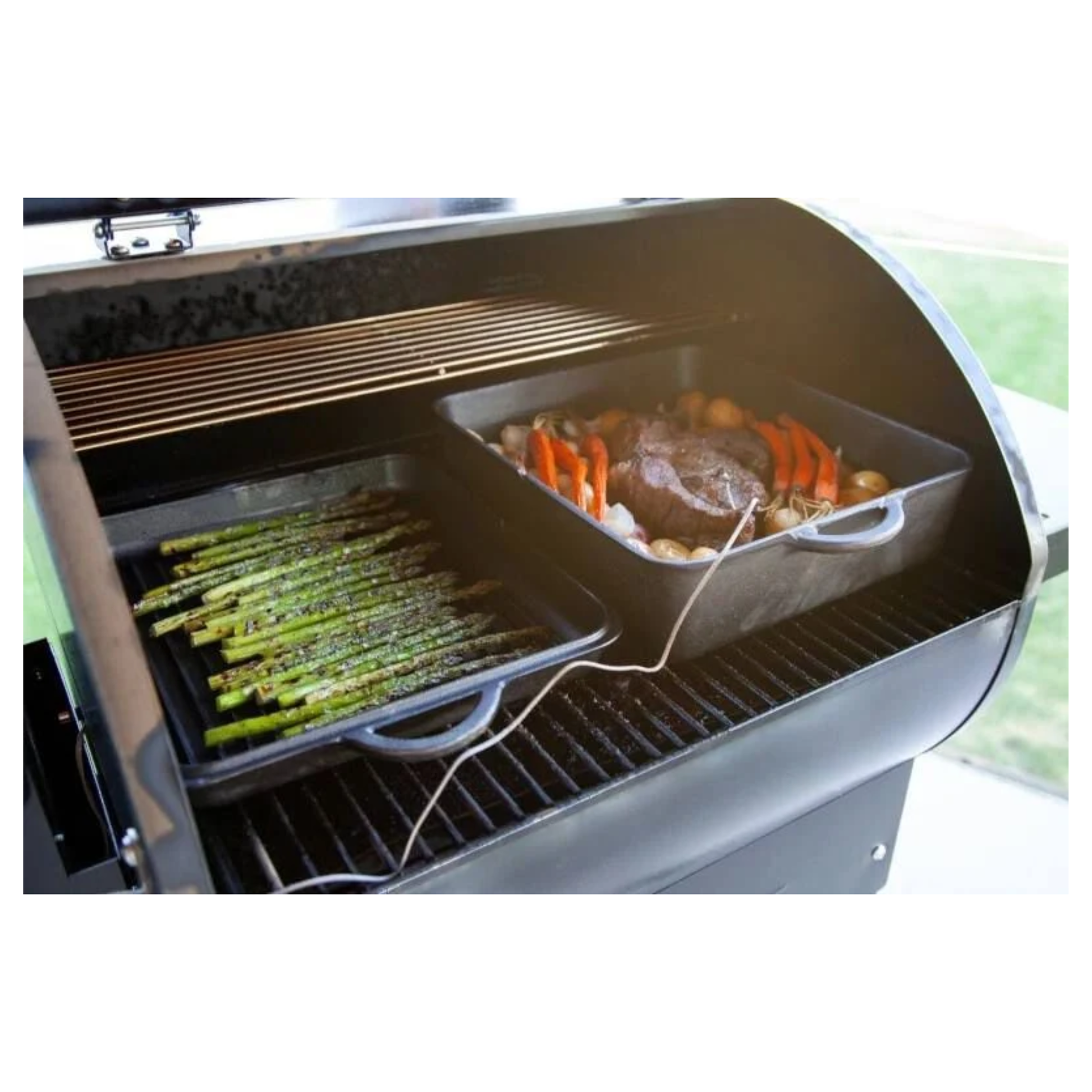 Veggetables and meat cooking on a Camp Chef DLX pellet grill 