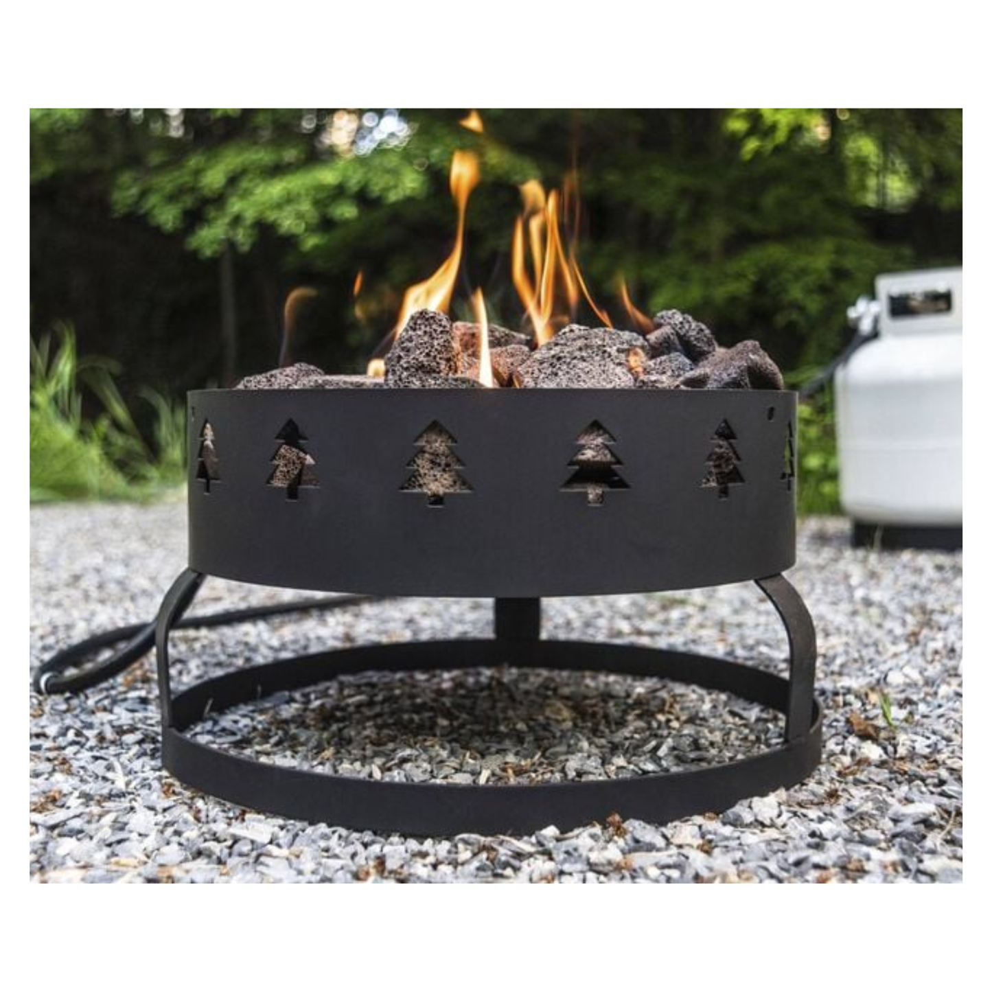 Camp Chef Sequoia Fire Pit burning outside.