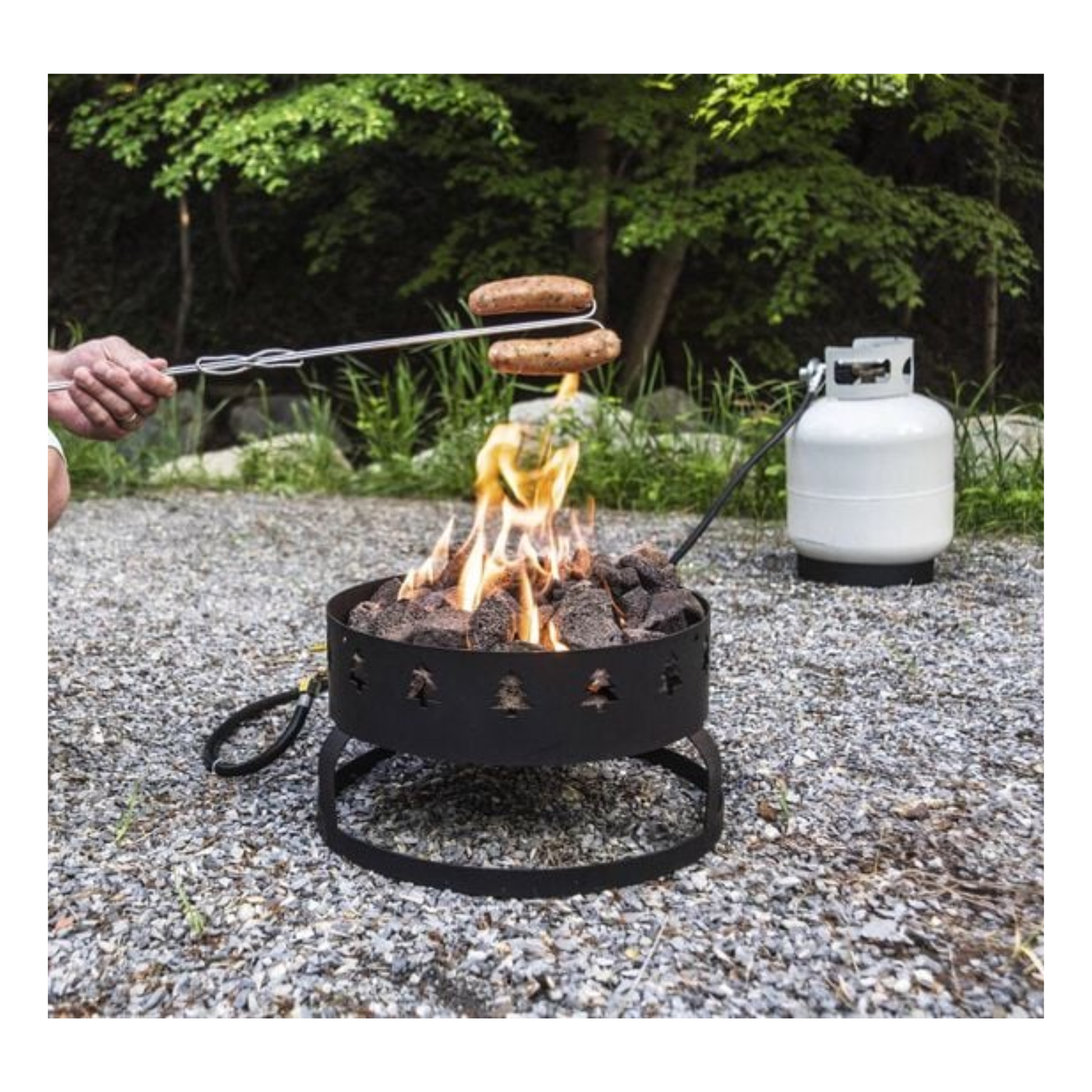 Person roasting hot dogs over sequoia fire pit.