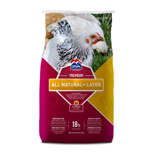 A bag of IFA All Natural Layer Crumble chicken feed with a picture of a chicken on the front, and product details including 18% protein and 1200 mg of DHA Omega-3.