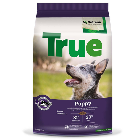 Nutrena True Puppy dog food package with a dog on the label against a white background